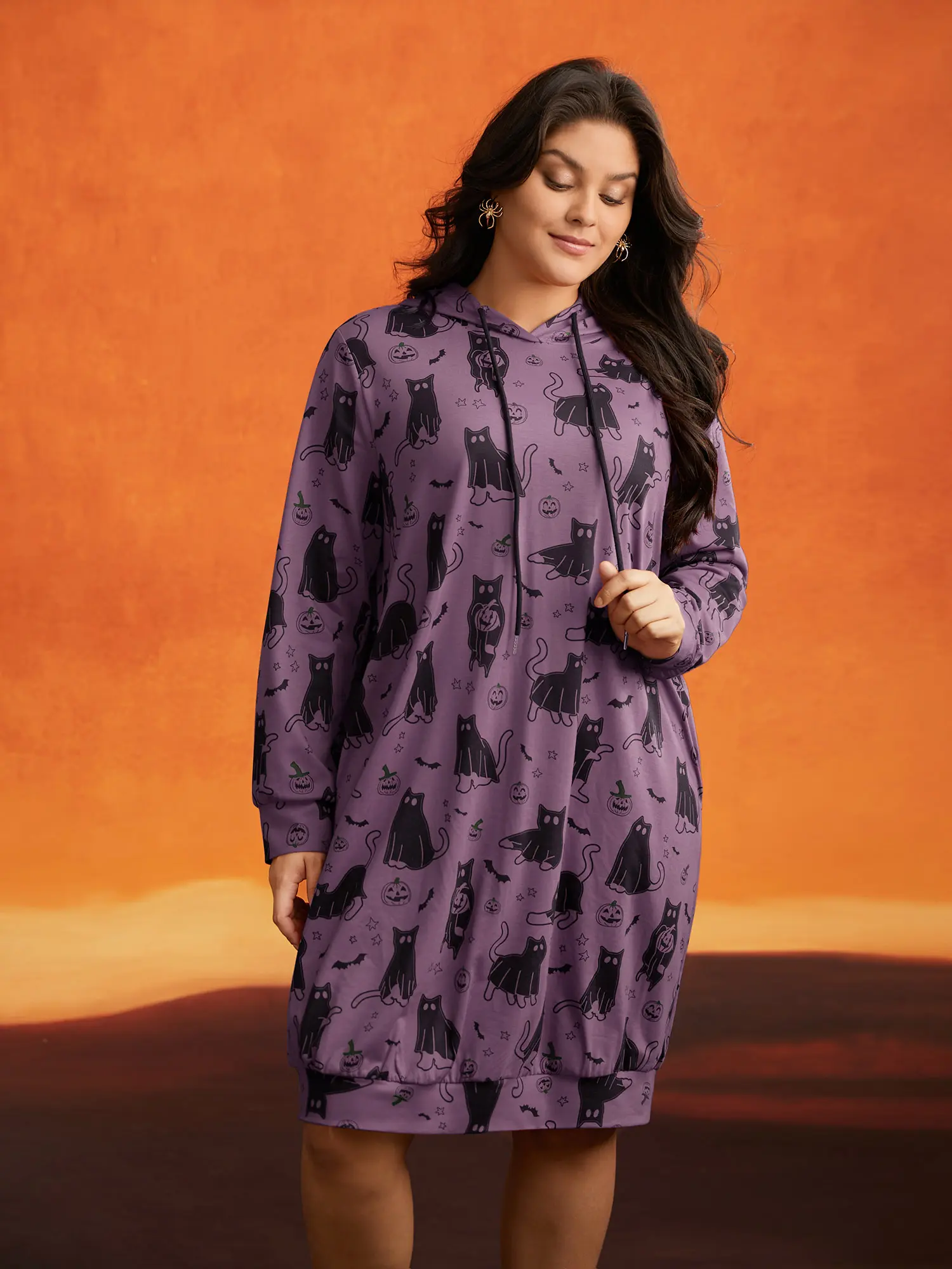 BloomChic Women's Oversized Pumpkin Cat Print Hooded Midi Dress, Casual Long Sleeve Polyester Fabric Pullover for a Party with Pocket, Spandex, Garment, Fit, Polyester Blend, Knee Length, Playful Party, Loose Cut, Elastane, Low Iron, Hood Neckline, Black