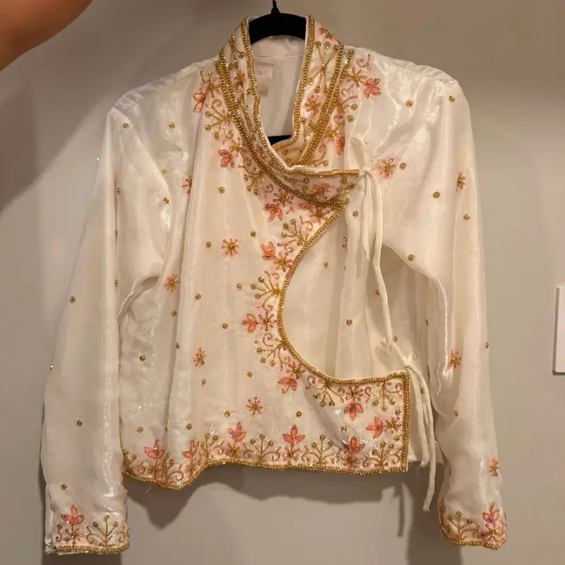 Traditional Nepali Chaubandi Cholo White Top with Intricate Pink and Gold Hand Embroidery
