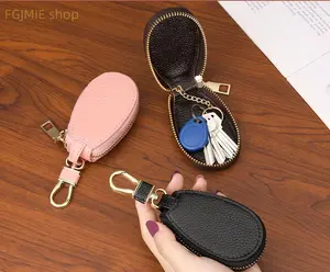 Includes shipping fee. Premium keychain bag for home use—multifunctional mini design with large capacity and zipper closure; stylish unisex car key pouch.