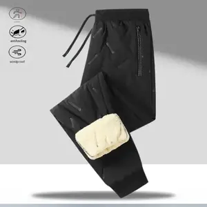 A pair of fleece lined casual pants, offering a cozy and warm style for autumn and winter. Featuring an adjustable drawstring waistband, soft fleece lining for comfort, zippered pockets for convenience, suitable for autumn and winter walks around the neig