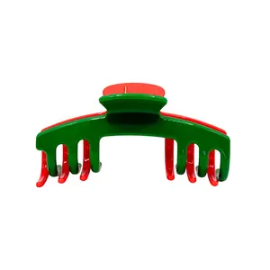 The Joy Limited-edition red & green Christmas hair claw that keeps your hair secure and your holiday vibes strong