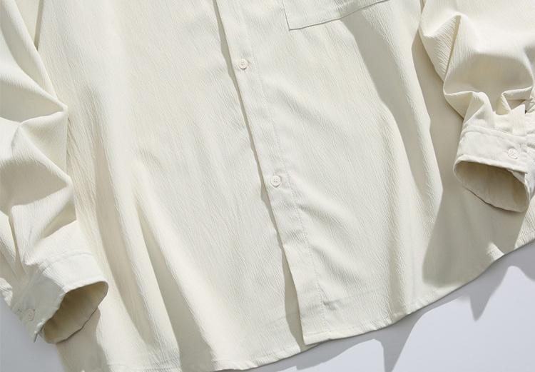 New Chinese-style long-sleeve top featuring bamboo leaf embroidery, a loose fit, frog buttons, design-forward retro high-end feel, and a drapey silhouette—a relaxed casual top with premium quality.