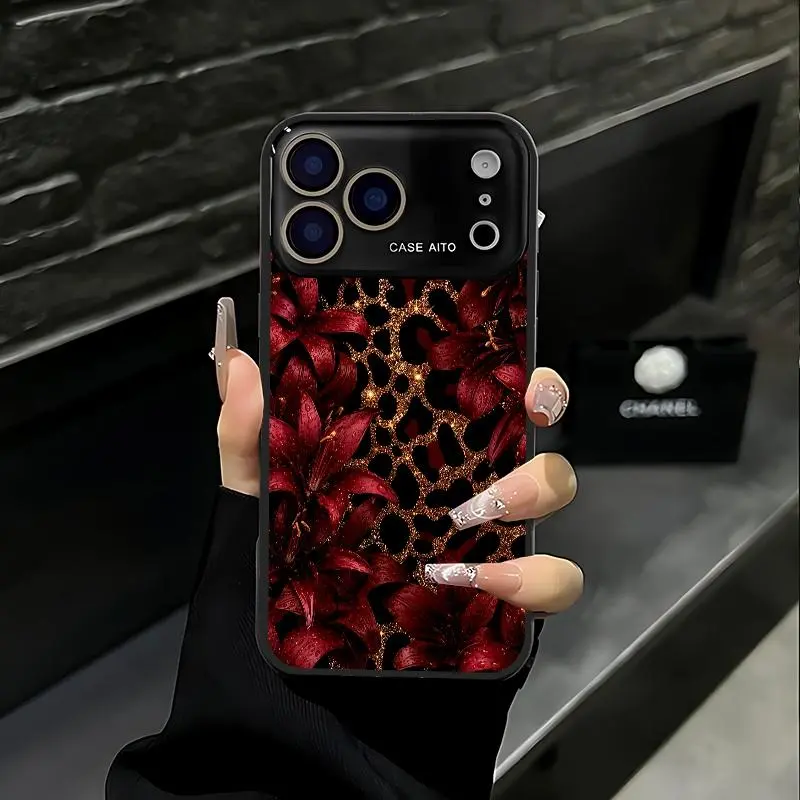 Black, gold and red lily leopard print phone case. Available for iPhone 17 Pro Max, 16 Pro Max, 15 Pro Max and 14 Pro Max. With lens protection. iPhone 15, 14, 13, 12. Made of skin-friendly TPU material.
