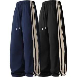 Men’s lightweight summer jogging pants featuring contrasting side stripes and a drawstring elastic waistband—casual athletic pants suitable for walking and street fashion styling.