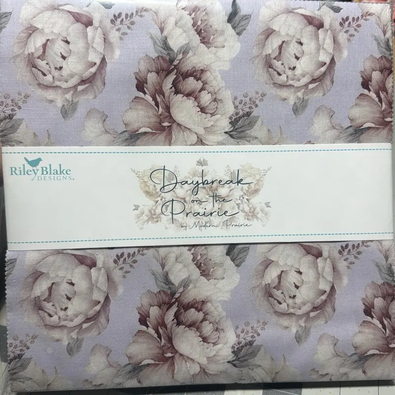 10 inch squares pre-cuts by Rylee Blake design day break on the prairie floral purple
