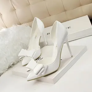Bow shaped slim high heels with elegant pointed edges and hollowed out side designs, fashionable women's high heels, and exquisite party attire, perfect for formal occasions and special events