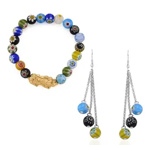 Shop LC Multi Color Murano Style Beaded Stretch Bracelet with Charm and Dangling Earrings in Goldtone and Stainless Steel Shop LC Multi Color Murano Style Beaded Stretch Bracelet with Charm and Dangling Earrings in Goldtone and Stainless Steel
