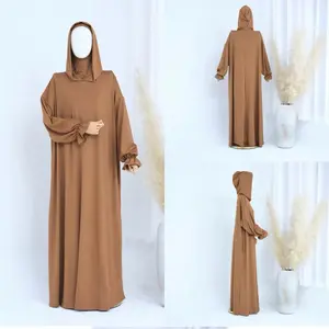 Prayer Dress with Built-In Hood, Hijab & Pockets   A thoughtfully designed long prayer dress created for comfort and modesty. The built-in hood-style hijab eliminates the need for a separate scarf, while side pockets add everyday practicality.