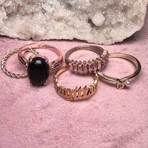 The 5 for 5 stack obsidian ring and astrological ring