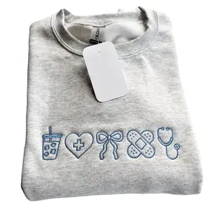 Embroidered Nurse Sweatshirt | Coquette Bow Nursing Crewneck | Nursing Student Pullover | CNA Sweatshirt | Cute Nurse Appreciation Gift