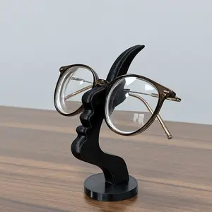 Side-face-shaped glasses bracket, unique curved glasses bracket, safe art storage scheme, enhanced desktop or bedside table decoration, practical minimalist black design, Desk Accessories.