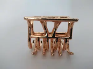 Small gold tone geometric metal hair claw clip