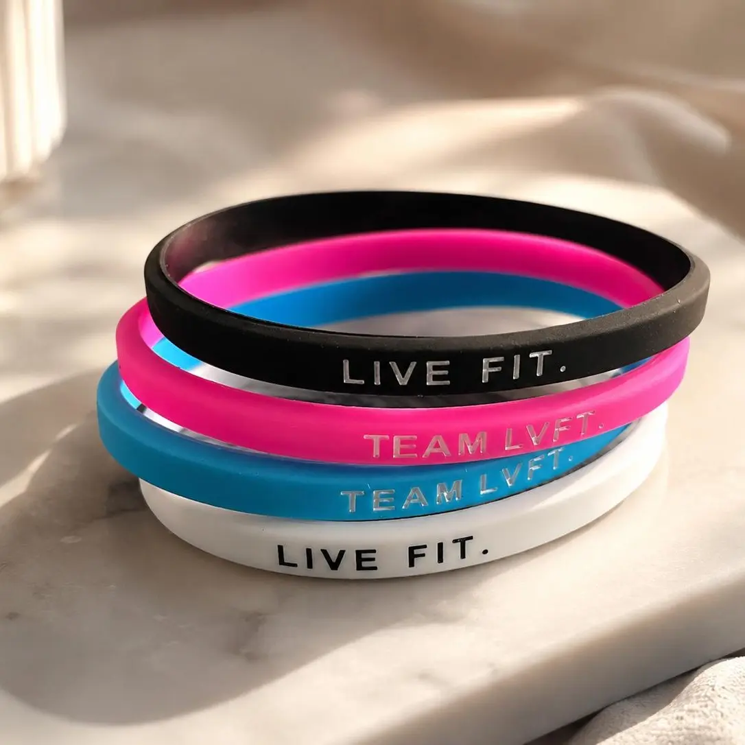 Live Fit Team LVRT Silicone Wristbands in Black Pink Blue and White for Fitness Enthusiasts