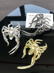 Three-piece set of metal-colored spider-shaped Spooky horror-themed Halloween decorations for women, featuring a half-up hairstyle at the back of the head, perfect for festive parties