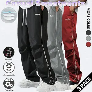 Loose-fitting sweatpants for men, grey side stripes with gold accent stripes, comfortable design, sports casual style bottoms, sweatpants, fitness wear, today's fashion outfit