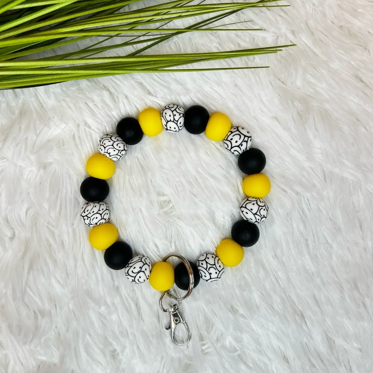 Yellow + Black Smiley Face Wristlet