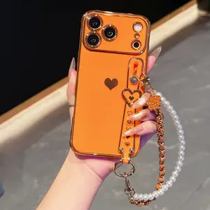 Electroplated side heart-shaped wrist strap suitable for Apple 17Promax women's hand chain phone case accessories 16/15/14 full protection anti-drop cover