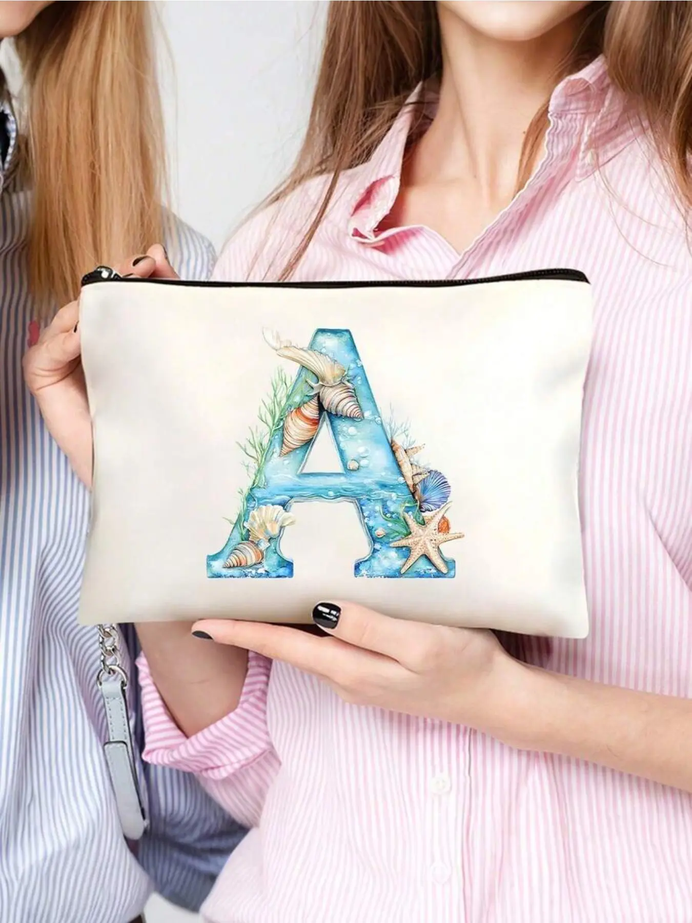 Personalized Letter Cosmetic Pouch Featuring seashell and floral patterns, large-capacity zipper makeup bag. Portable for travel, beach, school and daily use. Great gift for bridesmaids, birthdays, Valentine’s Day, Mother’s Day and weddings.