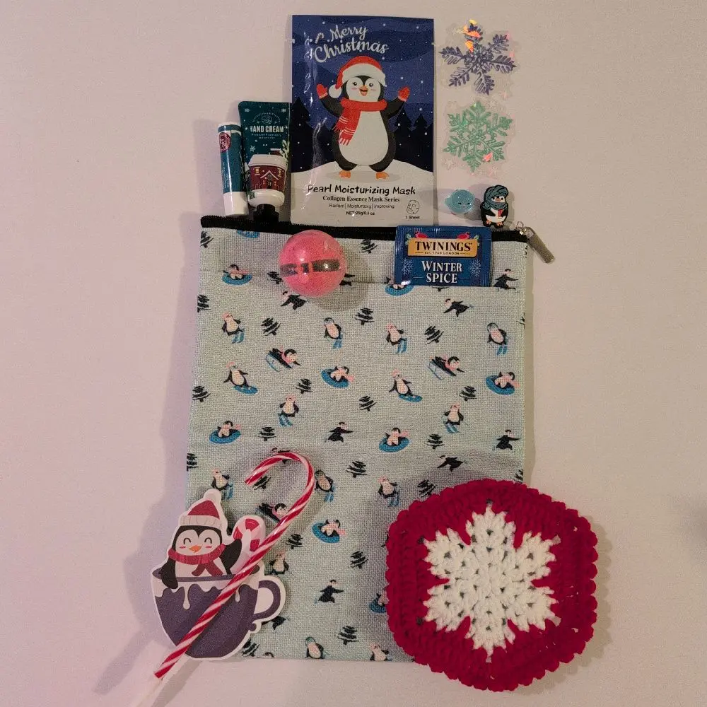 Penguin Book Tablet Sleeve Bundle Waterproof for Winter Christmas Holiday Gift Set with Crochet Coaster Bath Fizzer Resin Figure Shoe Charm Stickers Hand Cream Lip Balm Face Mask Notepad PEN