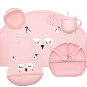 Tableware set 8-piece silicone that includes placemat, plate, bowl, spoon, fork, bib, cup with absorbent and lid.