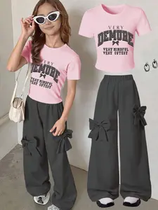 Fashion and Sweet Girl Casual Set 2-piece Set, featuring a simple letter bow short sleeved top and pink bow wide leg pants, suitable for spring, autumn, summer, parties, campus, and daily wear for girls