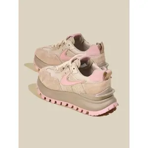 Stylish pink sneakers with thick chunky soles, retro-inspired platform design, breathable and antibacterial material, offering all-day comfort for casual street fashion.