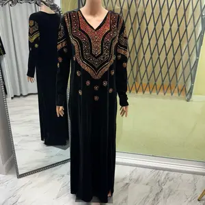 black velvet dress with rhinestone design on chest and sleeves