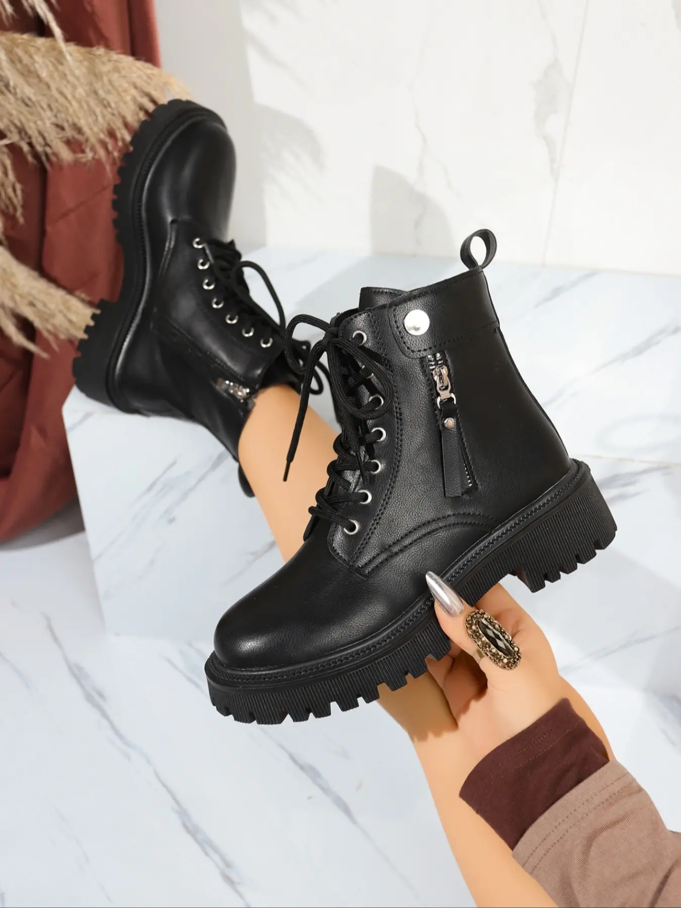 Elegant and comfortable women's riding boots suitable for outdoor wear. These stylish short boots match street fashion trends, making them perfect for casual outings and daily commutes. They feature practical design combined with unique elements. Footwear