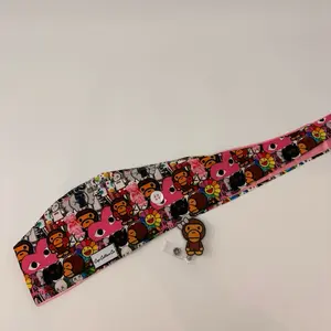 Kaws Scrub cap and badge reel