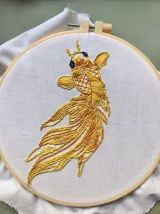 Handmade DIY kit for gold fish embroidery—stitch pattern and needle included