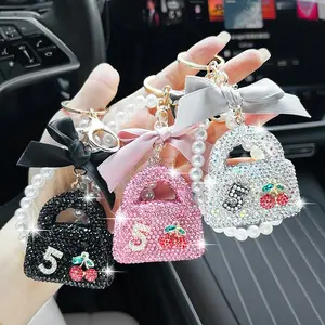 Luxury Crystal Car Keychain with Pearl Chain & Bowknot Design Creative Bling Bag Charm Stylish Auto Accessories Elegant Fashion Pendant Ornament Trendy Style Decoration Cute Hanging Accessory Perfect Gift for W Neo Keyl Advanced Universal Car GPS Detector