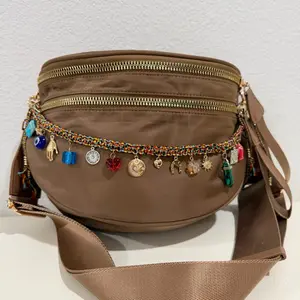 Elegant backpack available in a beautiful range of earthy tones. Accessory sold separately