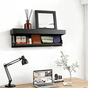 A modern, minimalist floating shelf with hidden storage compartments. This stylish black solid wood wall-mounted shelf is perfect for decorating living rooms, entryways, and offices.