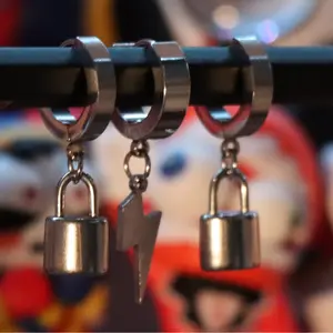 Locked in set - A 3‑piece silver hoop set with lightning and padlock charms for a bold, modern look.