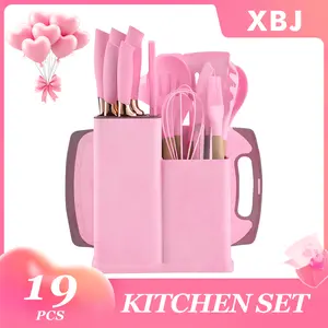 19-piece silicone kitchen utensil set includes a storage box and features a chef's knife, non-stick cookware, non-stick spoons, and a complete cookware set. Suitable for Valentine's Day and other occasions. Available in stylish white and pink.