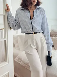 A women's blue and white striped Long Sleeve loose shirt with a stylish design, the stripes look slim and not stuffy, suitable for commuting to work, shopping and outdoor activities, indoor and outdoor dressing