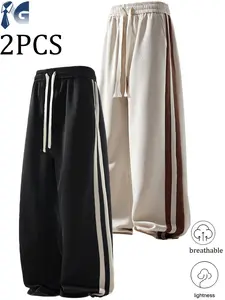 Two-piece straight-leg jogger set with side stripes, made from soft, lightweight fabric in a retro style. Suitable for both men and women, ideal for the gym, everyday workouts, jogging, work, strolling in Paris, Valentine’s Day, and Ramadan evenings. Pair