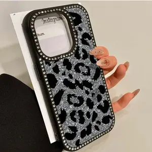 This black, shiny leopard print phone features diamond embellishments, a durable yet flexible hard back panel, and multiple layers of protection. It's compatible with iPhone 17, 16, 15, 14, 13, 12, and 11 models and makes a great gift for friends
