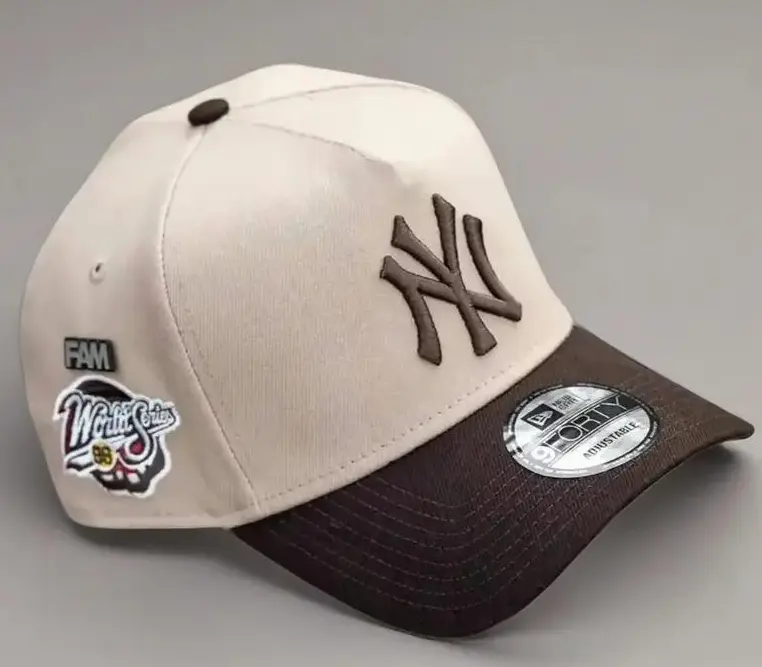9FORTY New York World Series Side Patch Baseball Cap – Cream & Brown, Adjustable Size, Brown NY Logo.